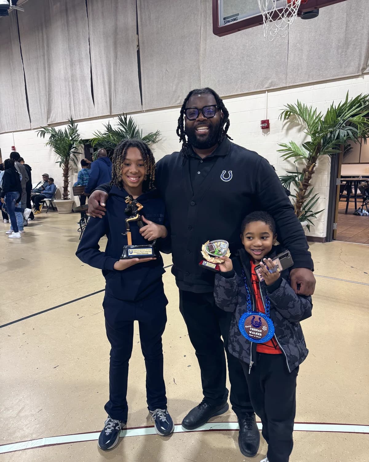 Bobby Christian with two students holding their trophies