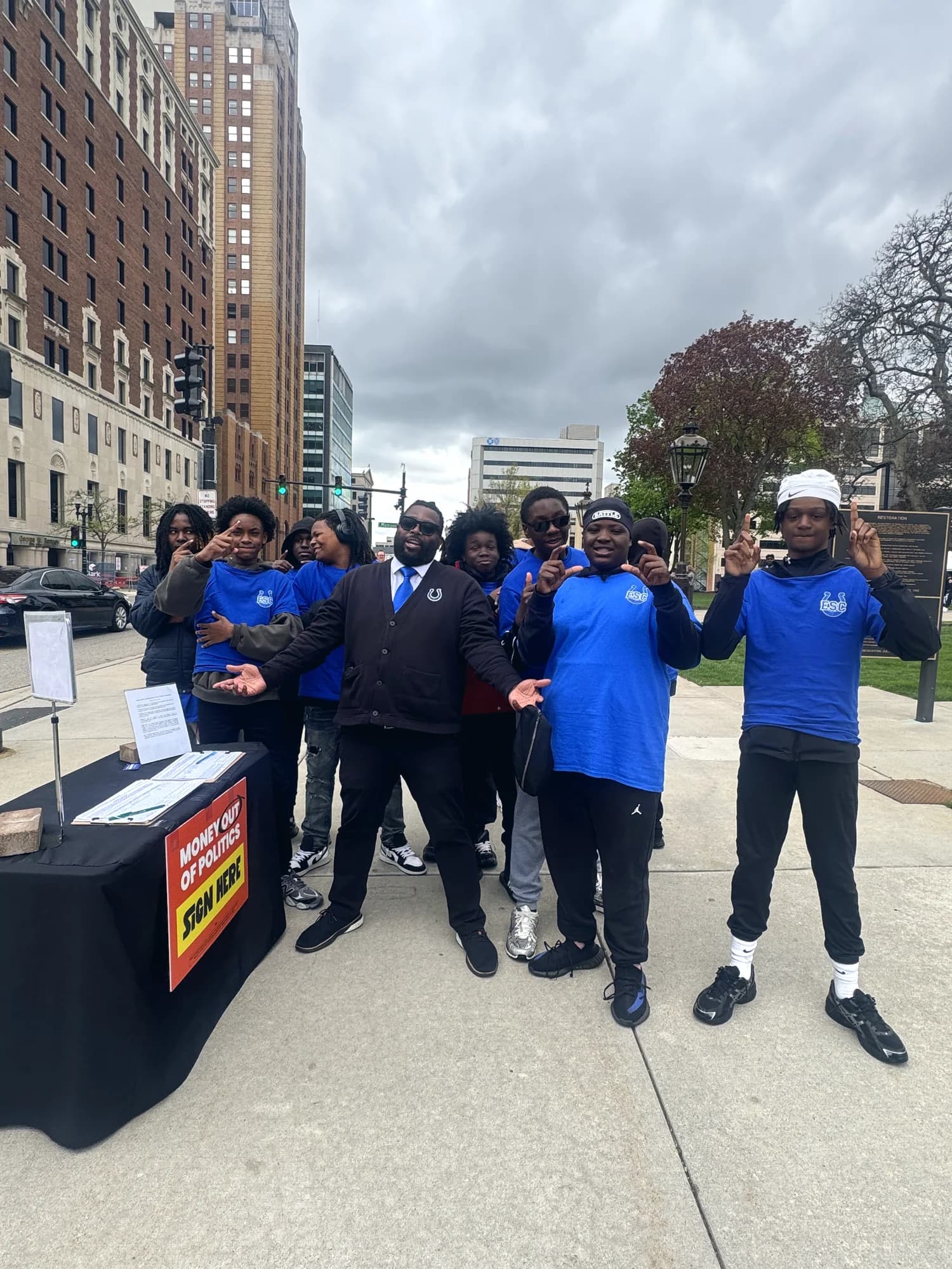 Bobby Christian and volunteers at a community outreach table in Detroit