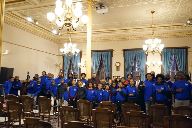 Detroit students seated in the Michigan State Capitol chamber