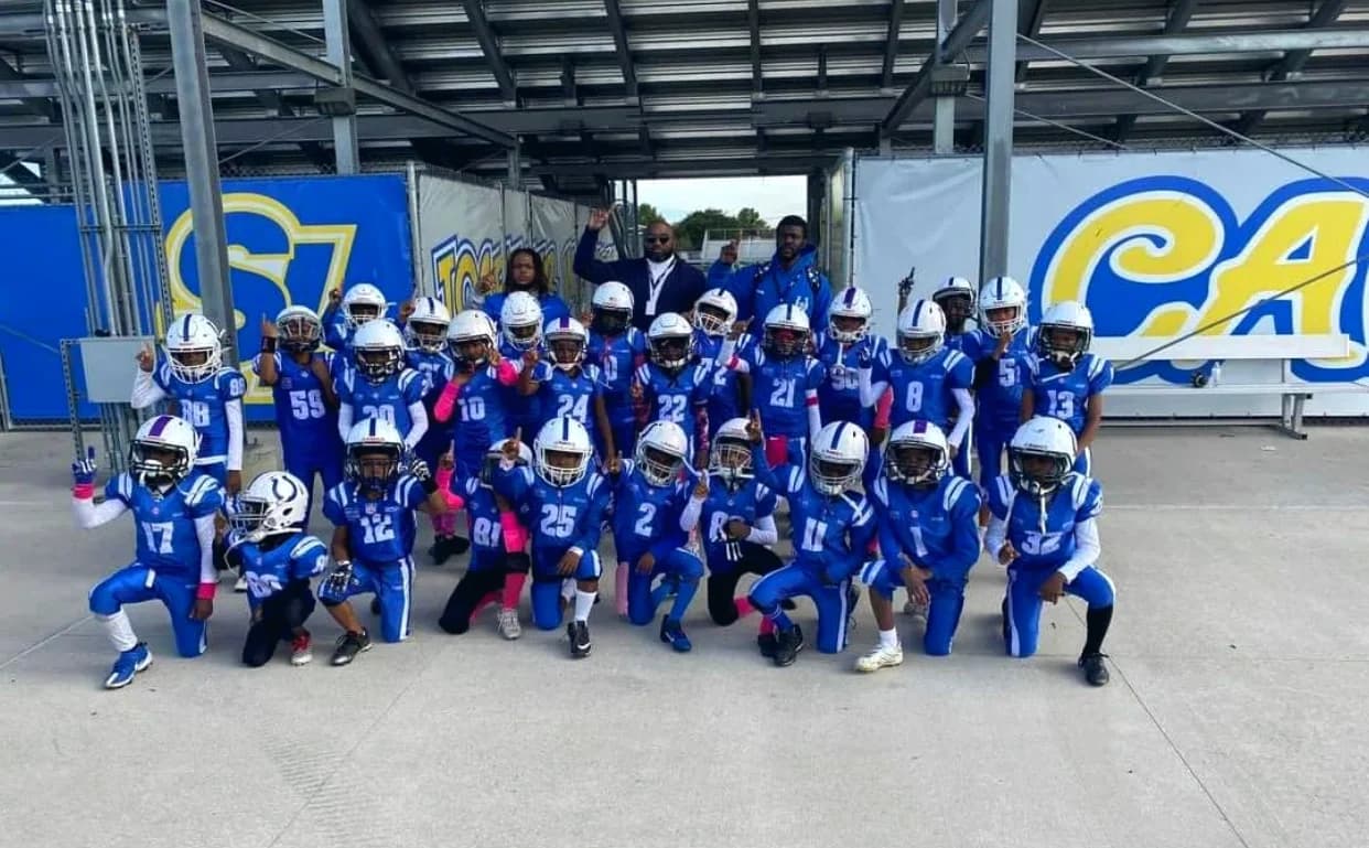 The Eastside Colts football and cheer squads posed together