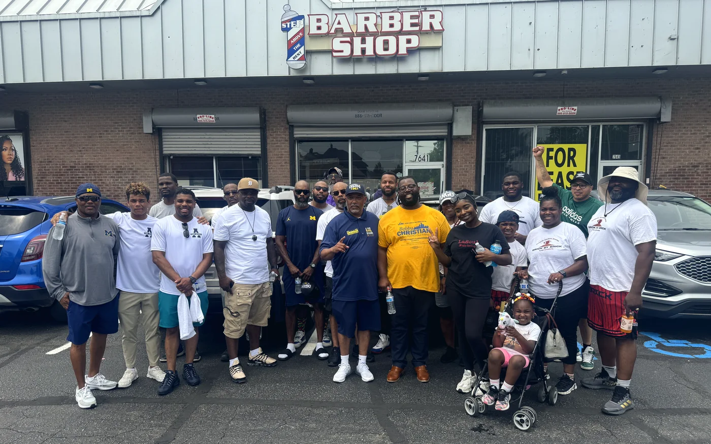 Bobby Christian with neighbours outside a Detroit barber shop