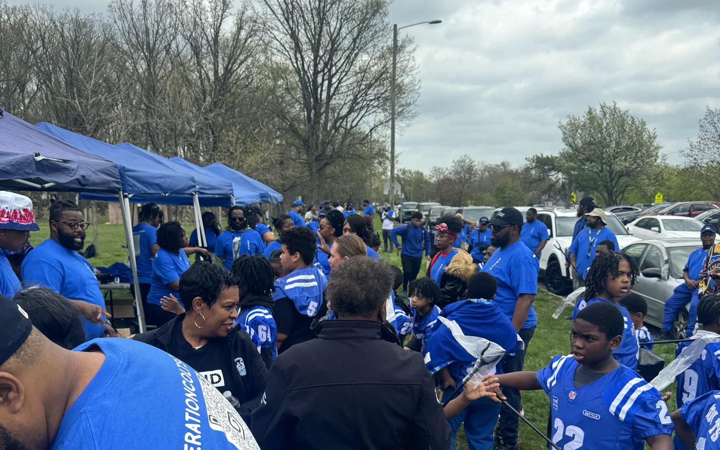 Volunteers and families at a neighbourhood cleanup day in Detroit