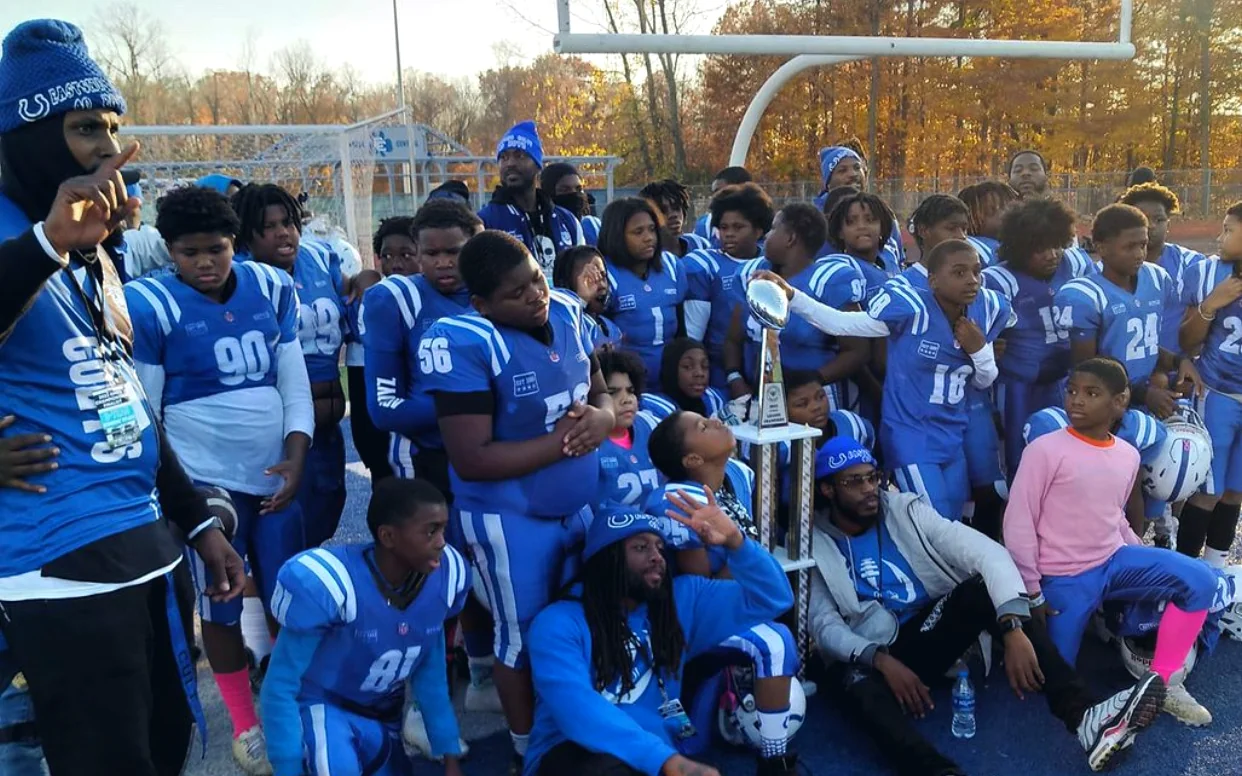 Eastside Colts players gathered on the field